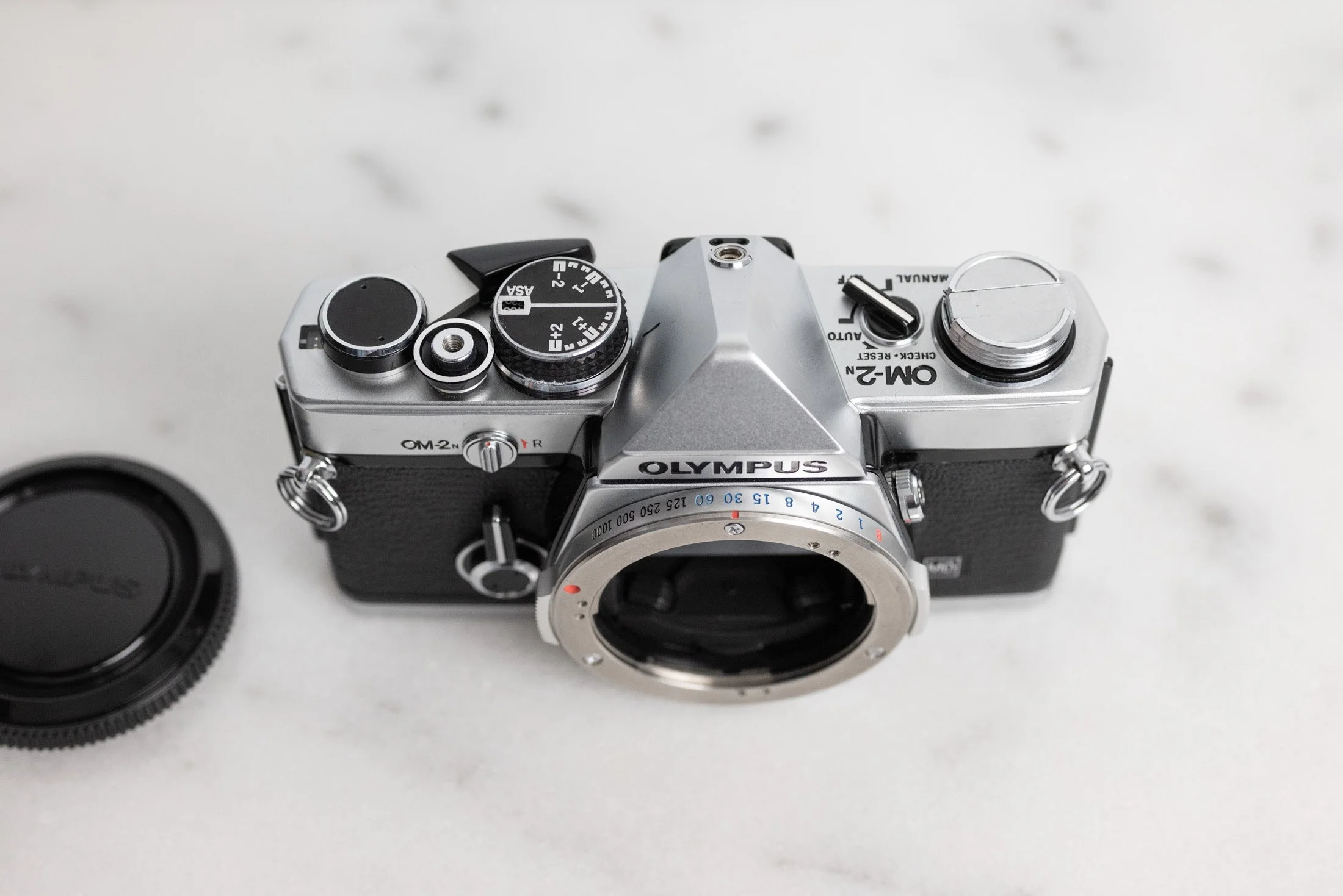 Olympus OM-2n 35mm Film SLR Camera with Body Cap and New